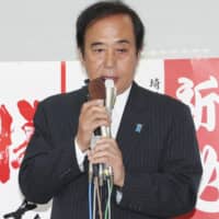Former Saitama Gov. Kiyoshi Ueda speaks before voters on Sunday in Asaka, Saitama, Prefecture. | KYODO