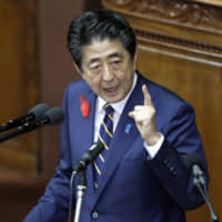 Prime Minister Shinzo Abe delivers his policy speech during an extraordinary session at the Lower House on Friday. | BLOOMBERG