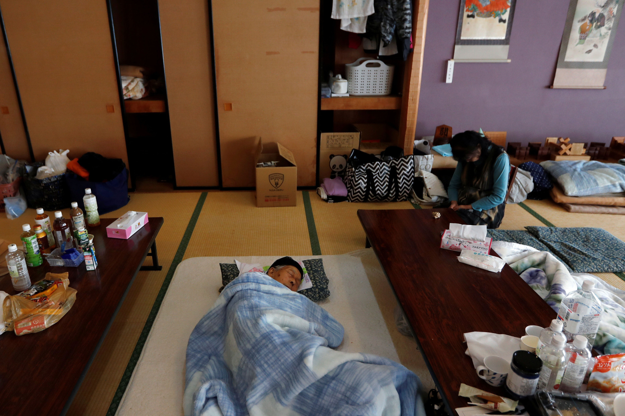 Seeking shelter: People rest at an evacuation center in the aftermath of Typhoon Hagibis in Date, Fukushima Prefecture. | REUTERS
