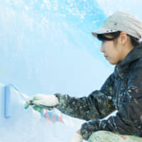 Mizuki Tanaka at work on a mural. | COURTESY OF MIZUKI TANAKA