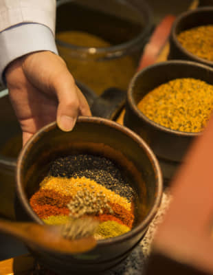 Seven lucky flavors: Mixing spices at Yagenbori's main store. Note that some countries ban the import of poppy seeds and hemp seeds. You may wish to ask for a customized blend excluding these ingredients. | ARISA KASAI