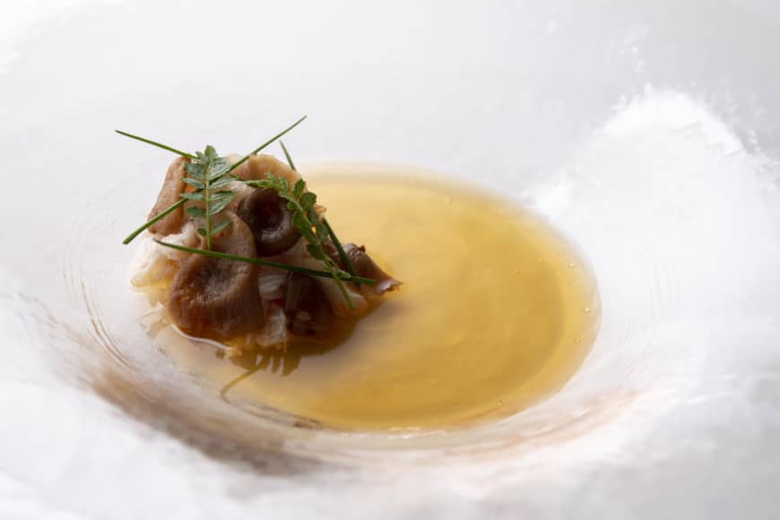 Umami-packed: Morsels of Hokkaido crab encased in slices of Yanomami mushrooms in a broth of dried mushrooms and kelp. | COURTESY OF COOK JAPAN PROJECT