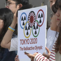 South Korean protesters stage a rally to boycott the 2020 Tokyo Olympics while calling it \"The Radioactive Olympic\" in front of the presidential Blue House in Seoul on Sept. 26. An anti-Japanese boycott has gained ground in South Korea since Tokyo tightened exports of materials used to manufacture semiconductors and display screens, key export items for South Korea. | AP