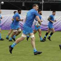 New Zealand\'s Brodie Retallick looks to pass the ball during a training session in Tokyo on Tuesday. The All Blacks face Ireland in a Rugby World Cup quarterfinal on Saturday at Tokyo Stadium. | AP