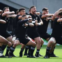 New Zealand\'s players perform the haka prior to their match against Namibia on Sunday at Tokyo Stadium. | AFP-JIJI