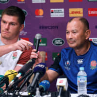 England coach Eddie Jones (right) and flyhalf Owen Farrell answer questions at a news conference in Tokyo on Thursday, two days ahead of their Pool D match against Argentina. | AFP-JIJI