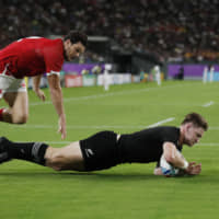 New Zealand\'s Jordie Barrett scores the team\'s second try against Canada at Oita Stadium on Wednesday. | REUTERS