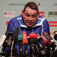 All Blacks coach Steve Hansen speaks at a news conference in Tokyo on Thursday. New Zealand will face England in the Rugby World Cup semifinals on Saturday. | AP
