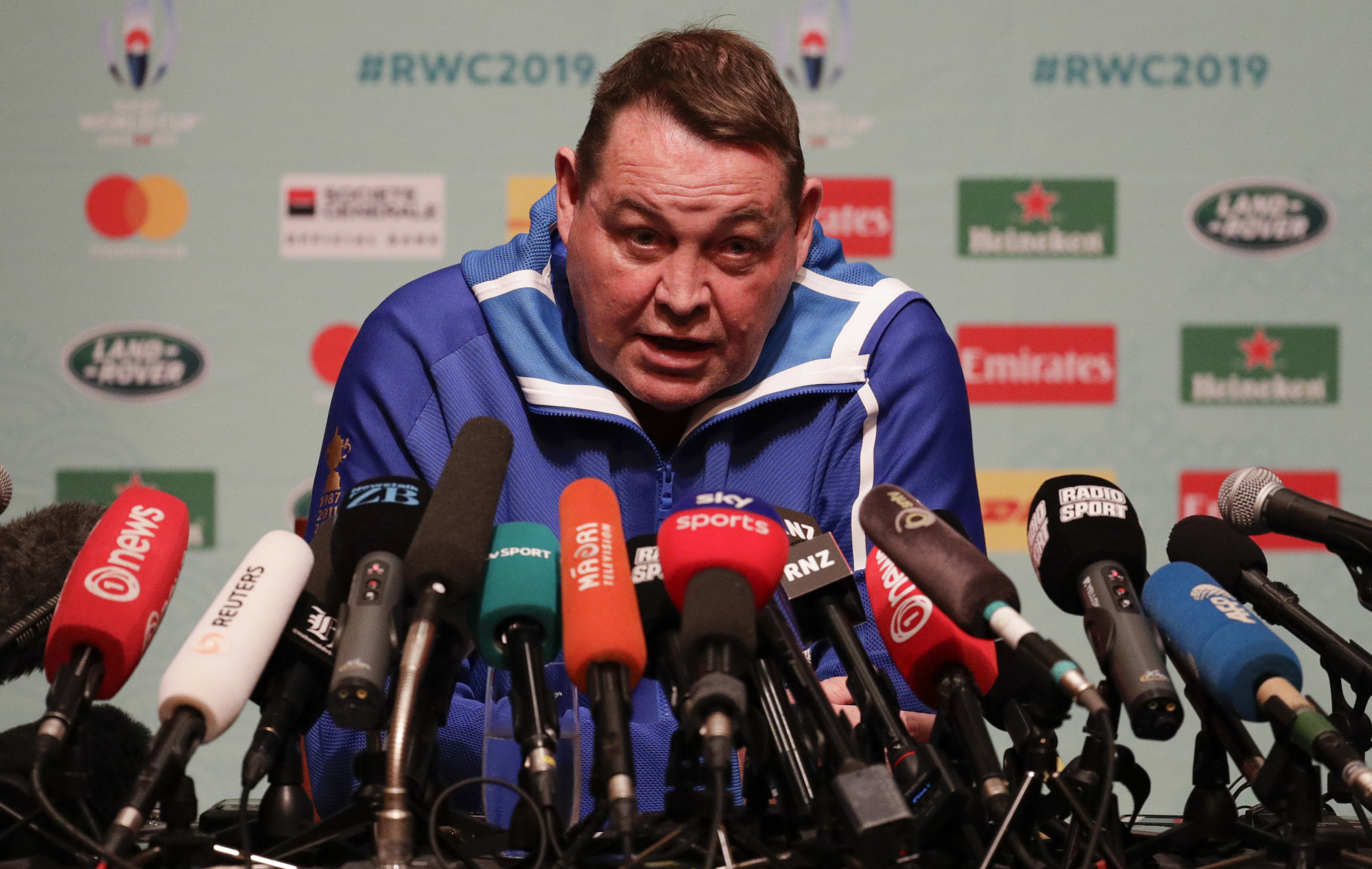 All Blacks coach Steve Hansen speaks at a news conference in Tokyo on Thursday. New Zealand will face England in the Rugby World Cup semifinals on Saturday. | AP