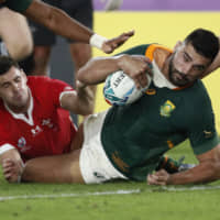 Damian  de Allende scores a try for South Africa against Wales on Sunday. | REUTERS