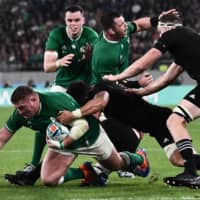 Ireland\'s Tadhg Furlong is tackled during Saturday\'s match. | AFP-JIJI