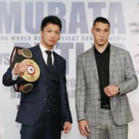 WBA middleweight champion Ryota Murata (left) and challenger Steven Butler pose for a photo during a news conference on Thursday in Tokyo. | KYODO