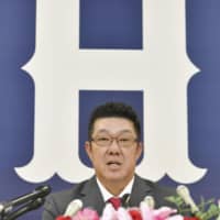 Shinji Sasaoka, the new manager of the Hiroshima Carp, speaks at a news conference on Monday in Hiroshima. | KYODO