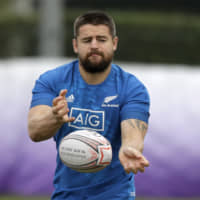 The All Blacks\' Dane Coles passes the ball during a training session in Tokyo on Tuesday. New Zealand plays Ireland in a Rugby World Cup quarterfinal on Saturday. | AP