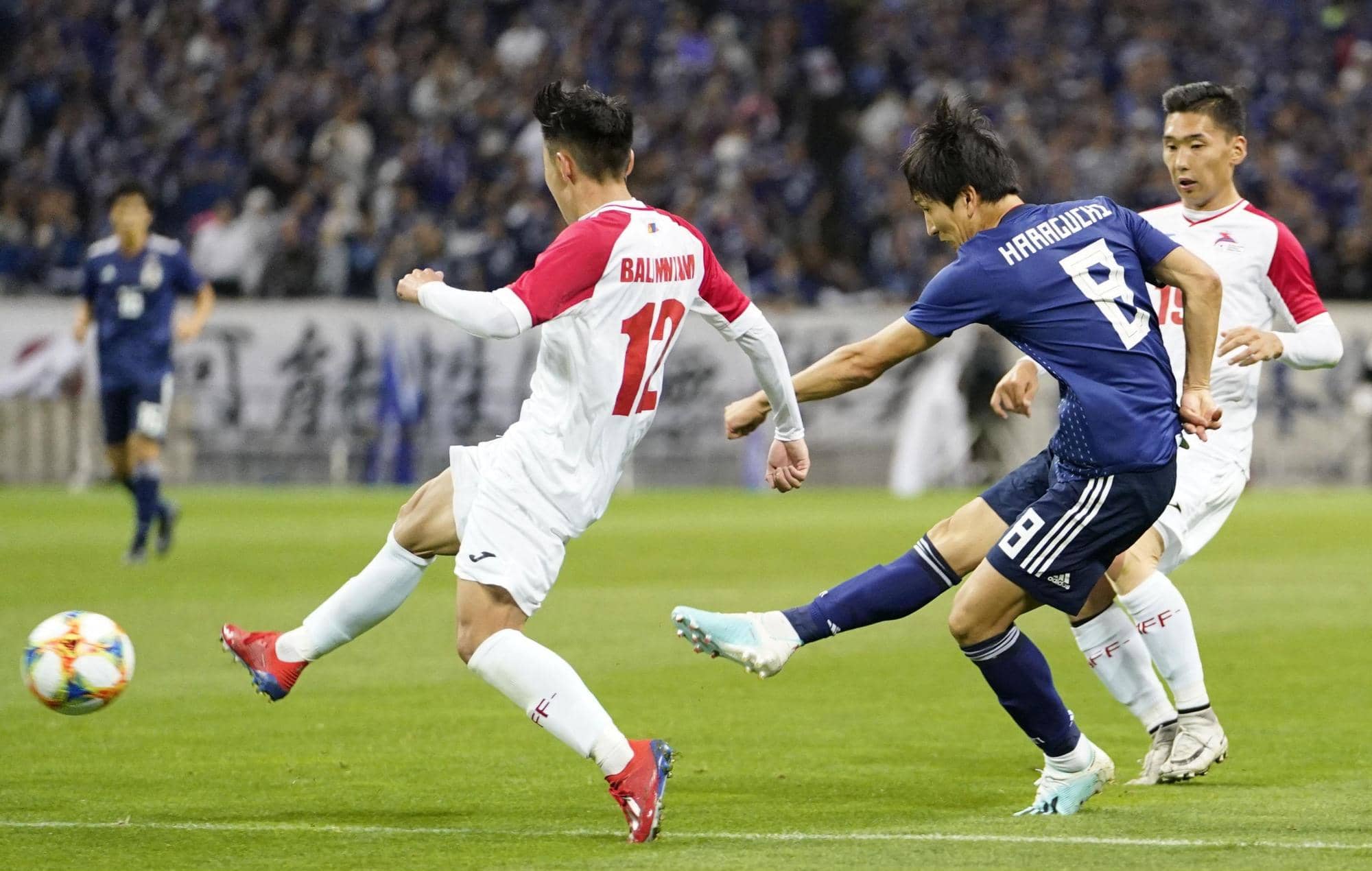 Japan's Genki Haraguchi takes a shot on goal against Mongolia in their 2022 World Cup qualifier on Thursday night at Saitama Stadium. KYODO | AFP-JIJI