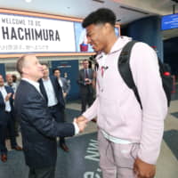 Rui Hachimura, seen being greeted by Washington Wizards GM Tommy Sheppard at Capital One Arena, has received major media attention in Japan since being drafted in the first round in June. | NBA PHOTOS