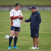 England\'s Ben Spencer (left) talks with head coach Eddie Jones during a training session at Fuchu Asahi Football Park in Tokyo on Tuesday. | REUTERS