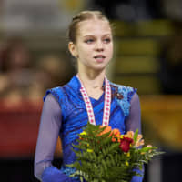 Alexandra Trusova sings the Russian national anthem after winning the Skate Canada women\'s title on Saturday. | AFP-JIJI