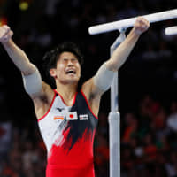 Kazuma Kaya reacts after his parallel bars performance at the 2019 World Artistic Gymnastics Championships in Stuttgart, Germany, on Sunday. | REUTERS