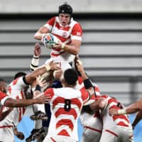 Japan\'s James Moore jumps for the ball in a lineout during Saturday\'s match against Samoa. | AFP-JIJI