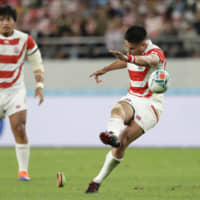 Japan\'s Yu Tamura kicks a penalty goal against South Africa in their Rugby World Cup quarterfinal on Sunday night. | AP