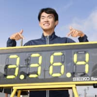 Masatora Kawana poses with his national record time after a race walking event on Sunday in Takahata, Yamagata Prefecture. | KYODO