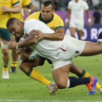 England\'s Kyle Sinckler scores a try against Australia in a Rugby World Cup quarterfinal match at Oita Stadium on Saturday. England beat Australia 40-16. | AP