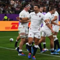 England\'s Jonny May (center) celebrates after scoring a try against Australia on Saturday. | AFP-JIJI