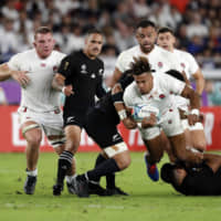 England\'s Anthony Watson tries to break away from the All Blacks during Saturday\'s Rugby World Cup semifinal at International Stadium Yokohama. | REUTERS