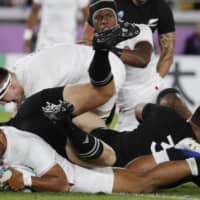 England\'s Manu Tuilagi scores the game\'s first try in the second minute against New Zealand on Saturday in a Rugby World Cup semifinal at International Yokohama Stadium in Yokohama. | AP