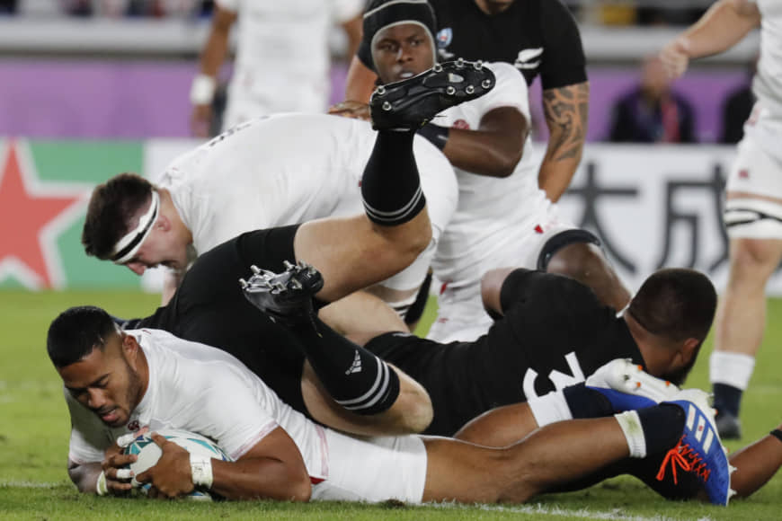 England's Manu Tuilagi scores the game's first try in the second minute against New Zealand on Saturday in a Rugby World Cup semifinal at International Yokohama Stadium in Yokohama. | AP