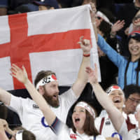 England fans celebrate the team\'s win over New Zealand. | AP