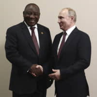 South African President, Cyril Ramaphosa (left), seen posing for a photo with Russian President Vladimir Putin in Sochi, Russia, on Oct. 23, will attend the Rugby World Cup final on Saturday in Yokohama. | AP