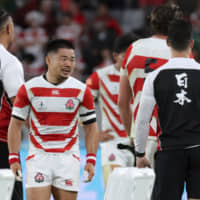 Fumiaki Tanaka reacts after Japan\'s defeat to South Africa in Sunday\'s Rugby World Cup quarterfinal at Tokyo Stadium. | AP