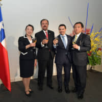 Ambassador of Chile Julio Fiol (second from left)with, from left, Asako Omi, parliamentary vice-minister for foreign affairs and member of the House of Representatives; Andy Bruce, president of the Chilean Chamber of Commerce in Japan (CHCCJ); and Teru Fukui, member of the House of Representatives and executive secretary of the Japan-Chile Parliamentary Friendship League, during a reception to celebrate the 209th anniversary of the independence of the Republic of Chile and the launching of CHCCJ at Andaz Tokyo Toranomon Hills on Sept. 25. | YOSHIAKI MIURA
