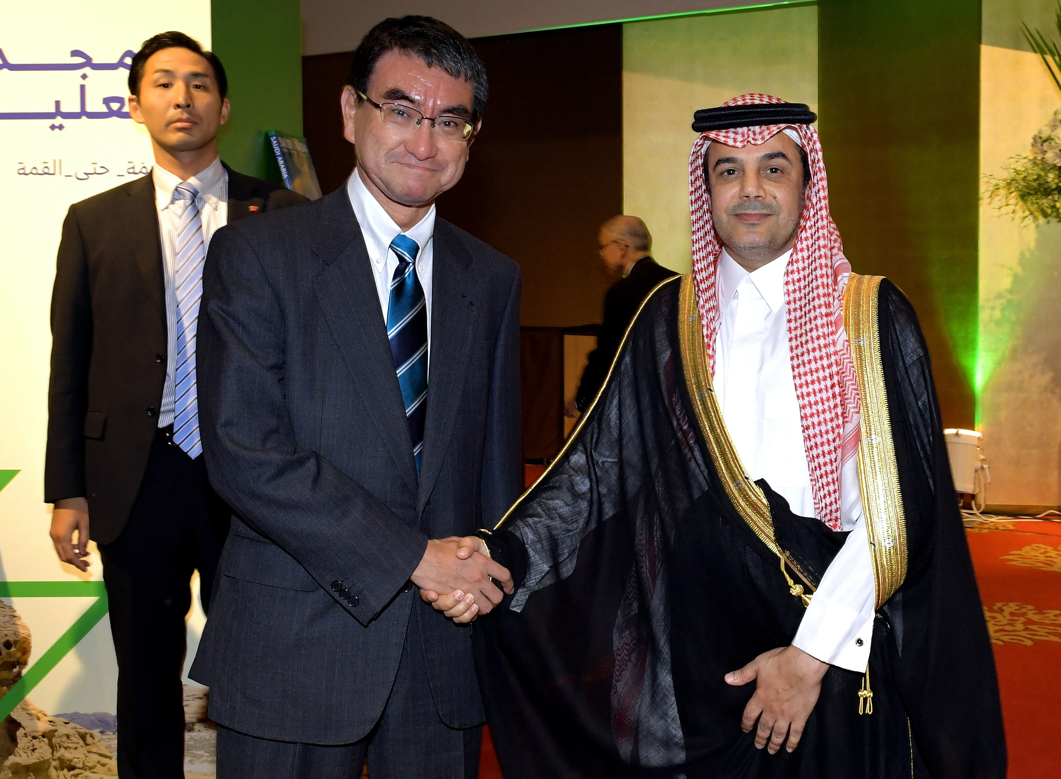 Ambassador of Saudi Arabia Nayef Mrzouq Alfahadi (right) welcomes Defense Minister Taro Kono (left) during a reception celebrating the 89th national day of the Kingdom of Saudi Arabia at The Okura Tokyo on Sept. 26. |  YOSHIAKI MIURA