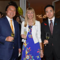 Ambassador-designate of the Federal Republic of Germany Ina Lepel (center) with State Ministers for Foreign Affairs Kenji Wakamiya (left) and Keisuke Suzuki (right) during a reception to celebrate the Day of German Unity at the ambassador\' s residence on Oct. 3. | YOSHIAKI MIURA