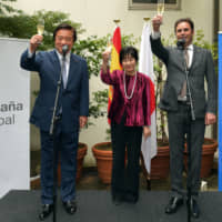 Spain Ambassador Jorge Toledo Albinana (right) raises a toast with State Minister for Foreign Affairs Kenji Wakamiya (left) and President of the House of Councillors Akiko Santo (center) during a reception celebrating Spain\'s National Day at the embassy on Oct. 11.      | YOSHIAKI MIURA