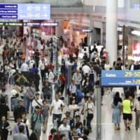 Travelers crowd Incheon International Airport near Seoul. Budget carrier Air Seoul Inc. reportedly plans to close half of its 12 offices in Japan amid frayed Japan-South Korea ties. | KYODO