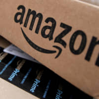 Amazon boxes are seen stacked for delivery in the Manhattan borough of New York City in 2016. | REUTERS