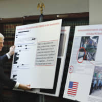 U.S. Attorney Richard P. Donoghue announces charges against Aventura Technologies Thursday in the Brooklyn borough of New York. The New York company has been charged with illegally importing and selling Chinese-made surveillance and security equipment to U.S. government agencies and private customers. | AP