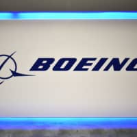 The Boeing logo is seen during the 70th annual International Astronautical Congress at the Walter E. Washington Convention Center in Washington last month. Boeing on Monday said it expected the 737 Max airplane, which was grounded after two crashes killed 346 people, to resume flying in January. \"In parallel, we are working towards final validation of the updated training requirements, which must occur before the MAX returns to commercial service, and which we now expect to begin in January,\" Boeing said. | AFP-JIJI