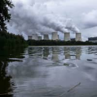 Emissions rise from cooling towers at the Jaenschwalde lignite-fired power plant, operated by Lausitz Energie Bergbau AG, in Germany. | BLOOMBERG