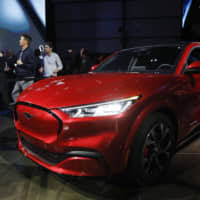 Ford Motor Co.\'s Mustang Mach E electric sport utility vehicle is unveiled in Hawthorne, California, on Sunday. | BLOOMBERG
