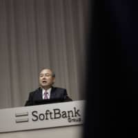 Masayoshi Son, chairman and chief executive officer of SoftBank Group Corp., speaks during a news conference in Tokyo on Nov. 6. | BLOOMBERG
