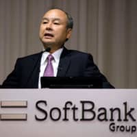 SoftBank Group CEO Masayoshi Son answers questions during a news conference on the company\'s financial results in Tokyo on Wednesday, announcing that the firm suffered an operating loss of &#36;6.4 billion in the second quarter, the worst in its history. | AFP-JIJI