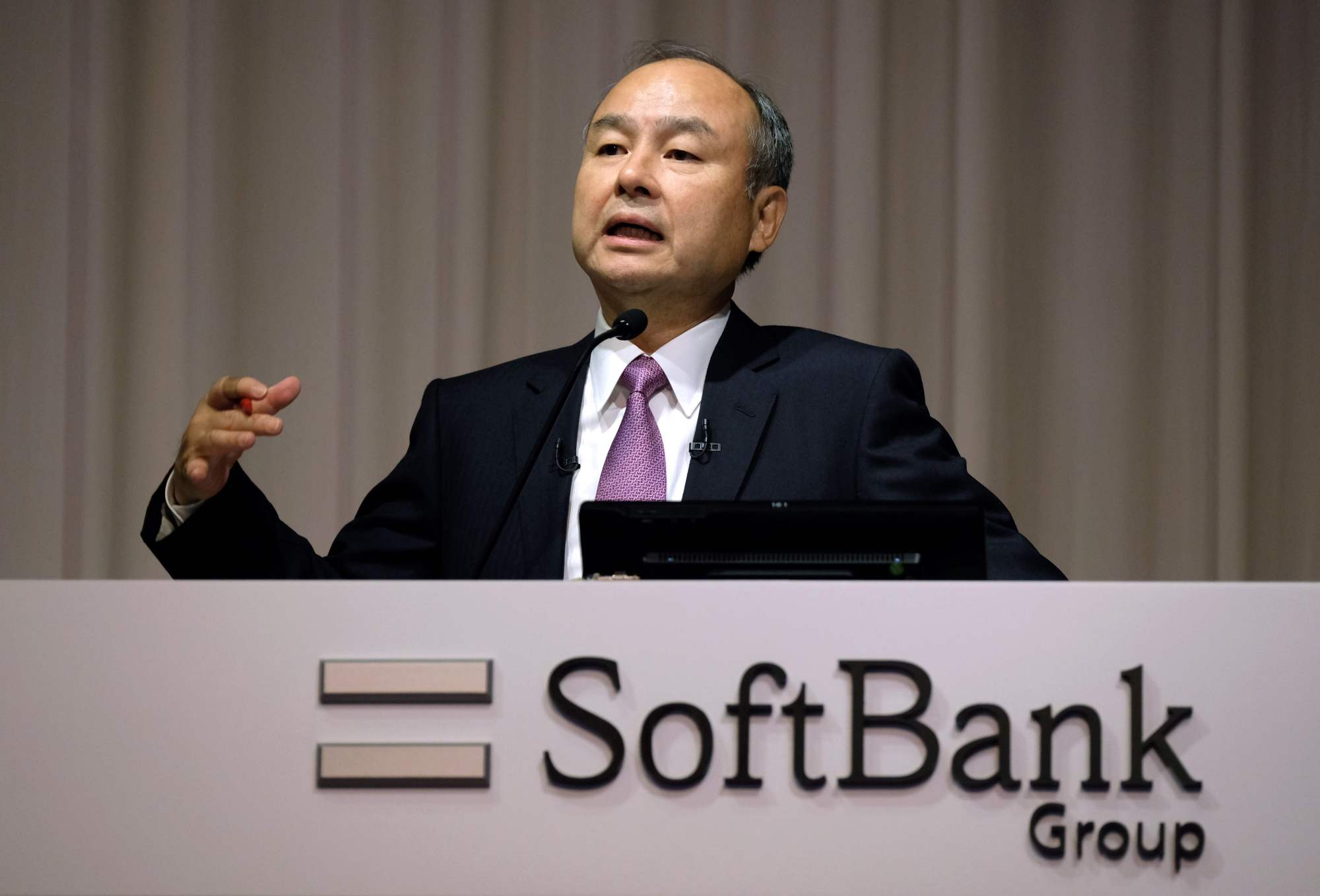 SoftBank Group CEO Masayoshi Son answers questions during a news conference on the company's financial results in Tokyo on Wednesday, announcing that the firm suffered an operating loss of &#36;6.4 billion in the second quarter, the worst in its history. | AFP-JIJI