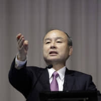 Masayoshi Son, chairman and chief executive officer of SoftBank Group Corp., takes a question during a news conference in Tokyo on Nov. 6. | BLOOMBERG