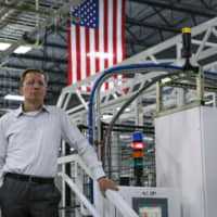 Tom Werner, chairman and chief executive officer of SunPower Corp., stands for a photograph at a facility in Hillsboro, Oregon, Aug. 7. Over the past two years, SunPower was hit with duties on panels it makes overseas; won an exemption; was threatened with tariffs on equipment it makes in Mexico; and watched rivals gain access to a tariff loophole. | BLOOMBERG