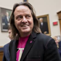John Legere, chief executive officer of T-Mobile US Inc., waits to begin a House Judiciary Subcommittee hearing in Washington in March. | BLOOMBERG
